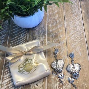 Kathy Van Zeeland puffer heart silver earrings.